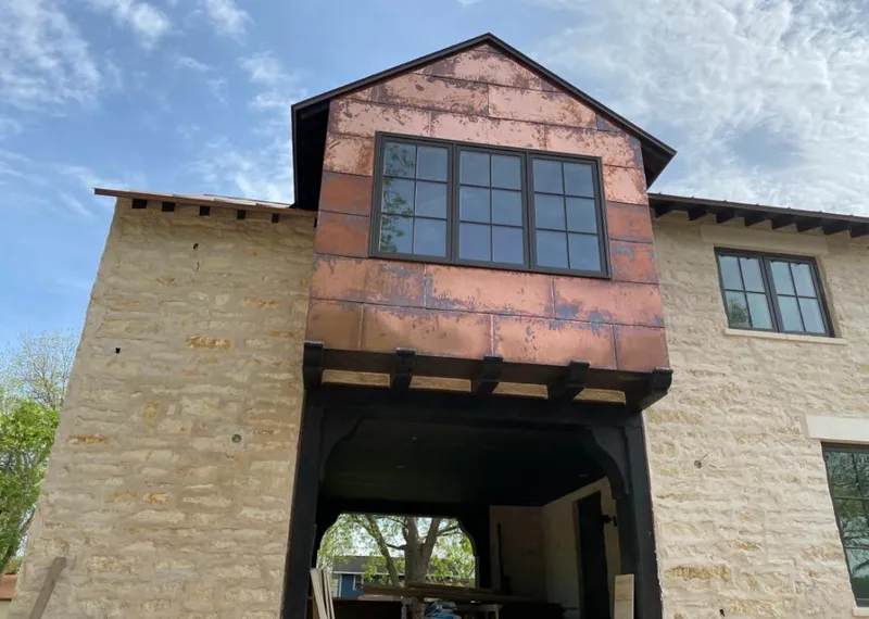 Copper metal panel facade on a stone building for Metal Roof Coating in Pevely