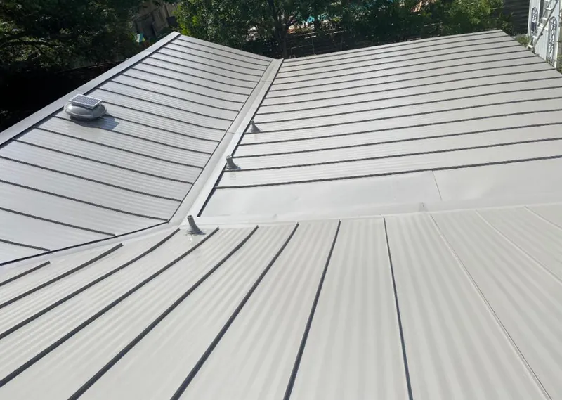 Solar attic fan installed on a metal roof for Roof Ventilation in Pevely